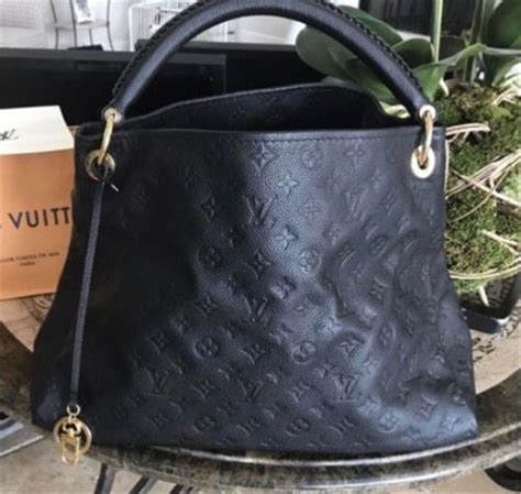 lv purse black and gold|black embossed Lv purse.